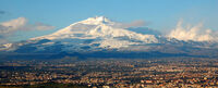 Quiet Etna, towering above the city of Catania.