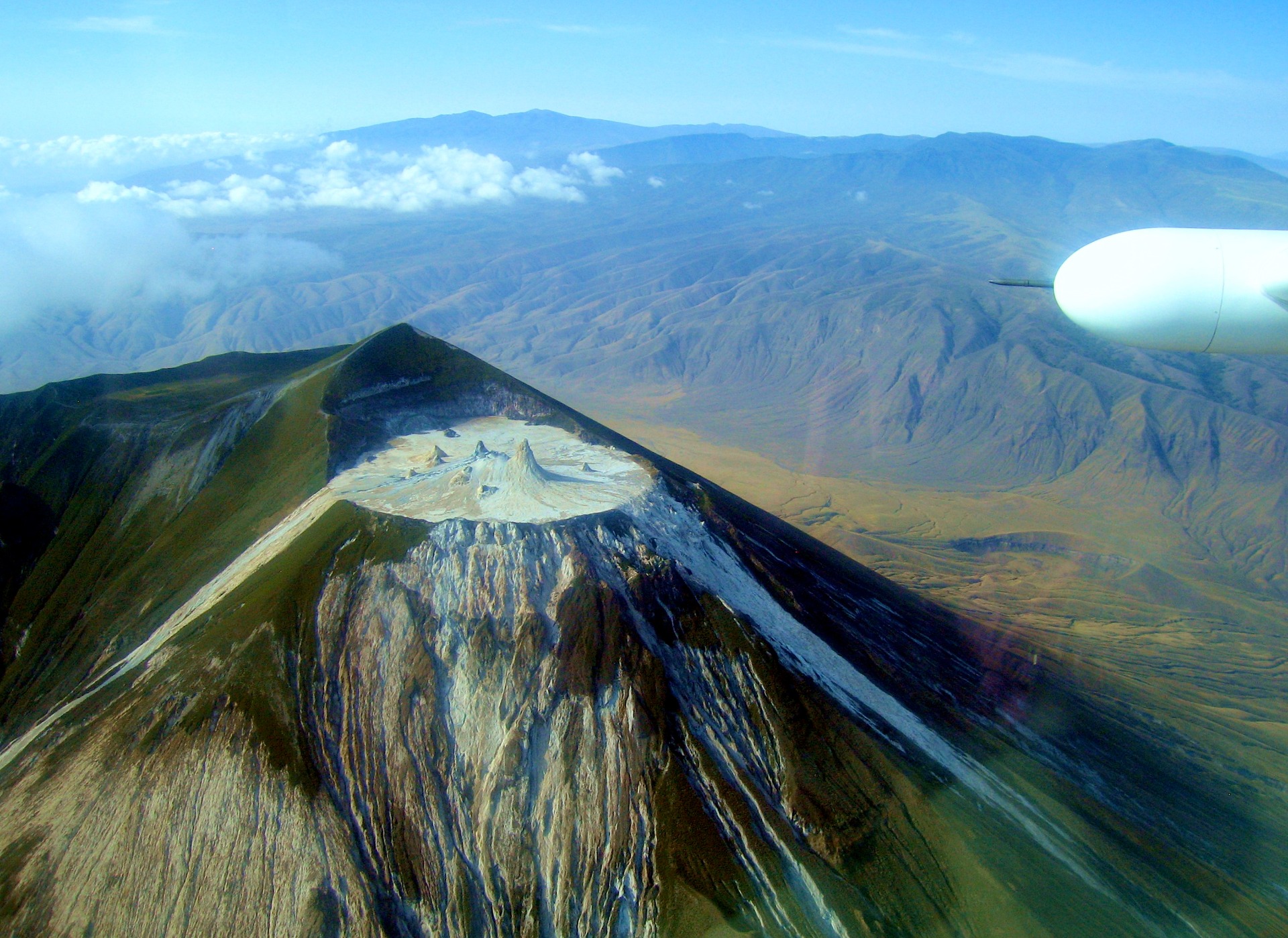 Carbonatite lava at Oldoinyo Lengai. (WCalvin, Wikipedia).